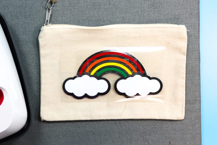 How to Layer Heat Transfer Vinyl Pencil Pouch with Heat transfer vinyl still on carrier sheet but layered in rainbow design